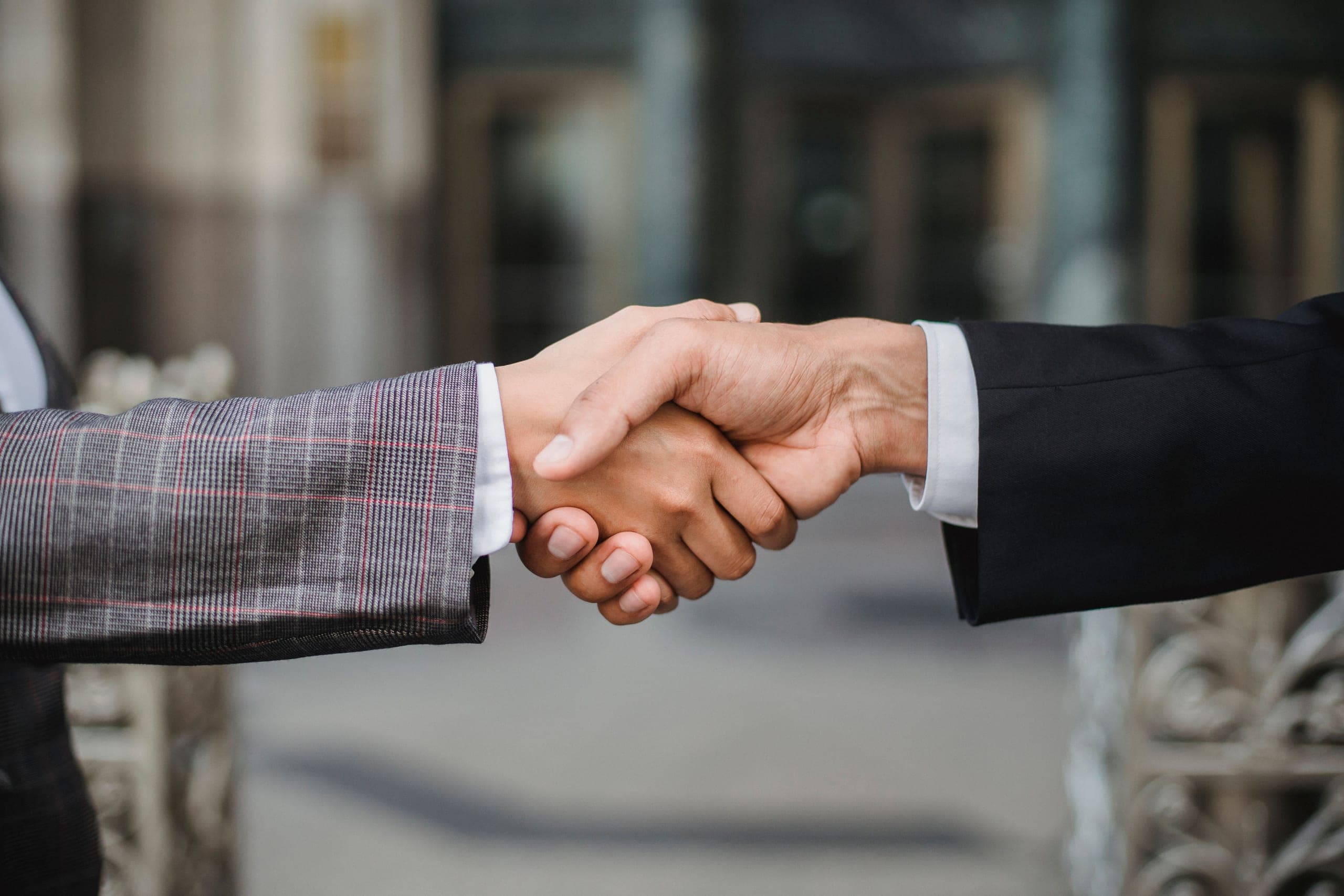 Two business professionals shaking hands