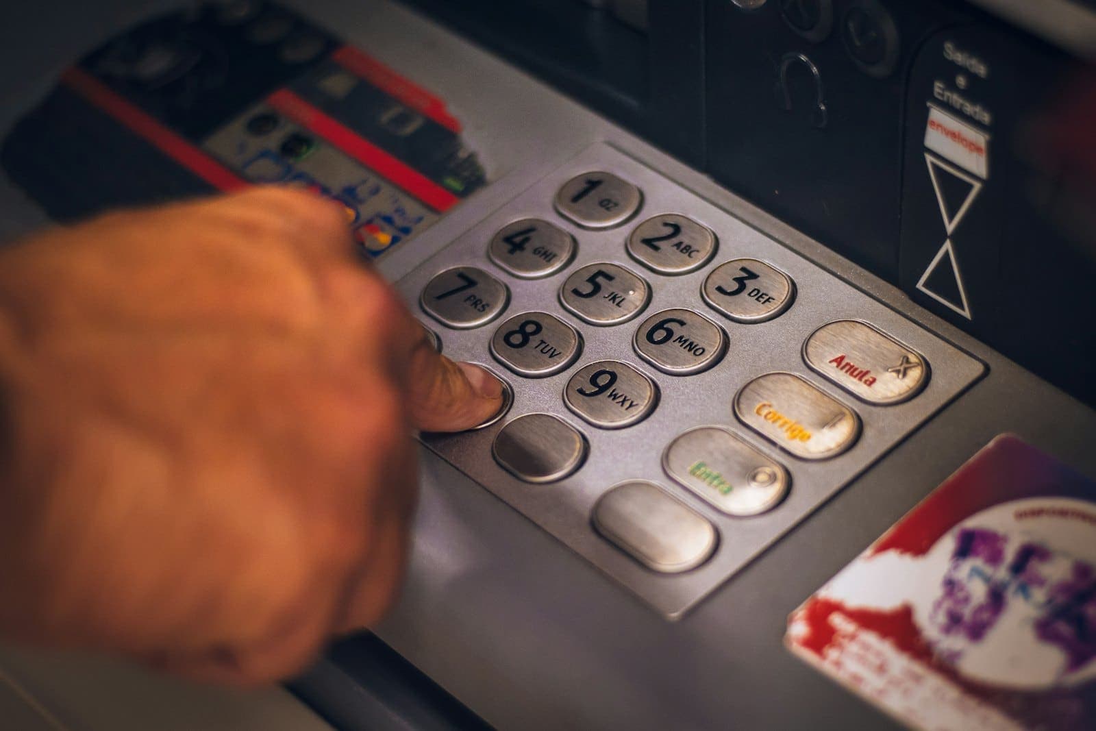 Customer using an ATM keypad