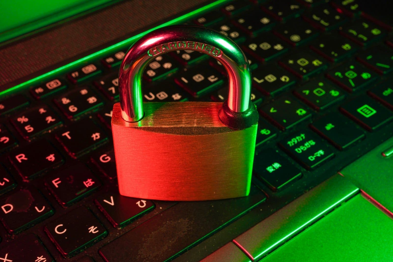 Padlock resting on an illuminated laptop keyboard